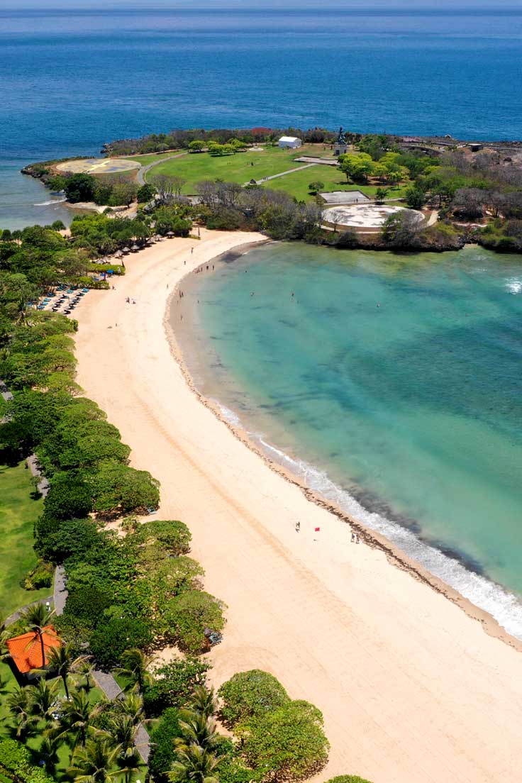 The white sands of Nusa Dua beach in Bali Indonesia showing why Nusa Dua ia the perfect bali beach destination.