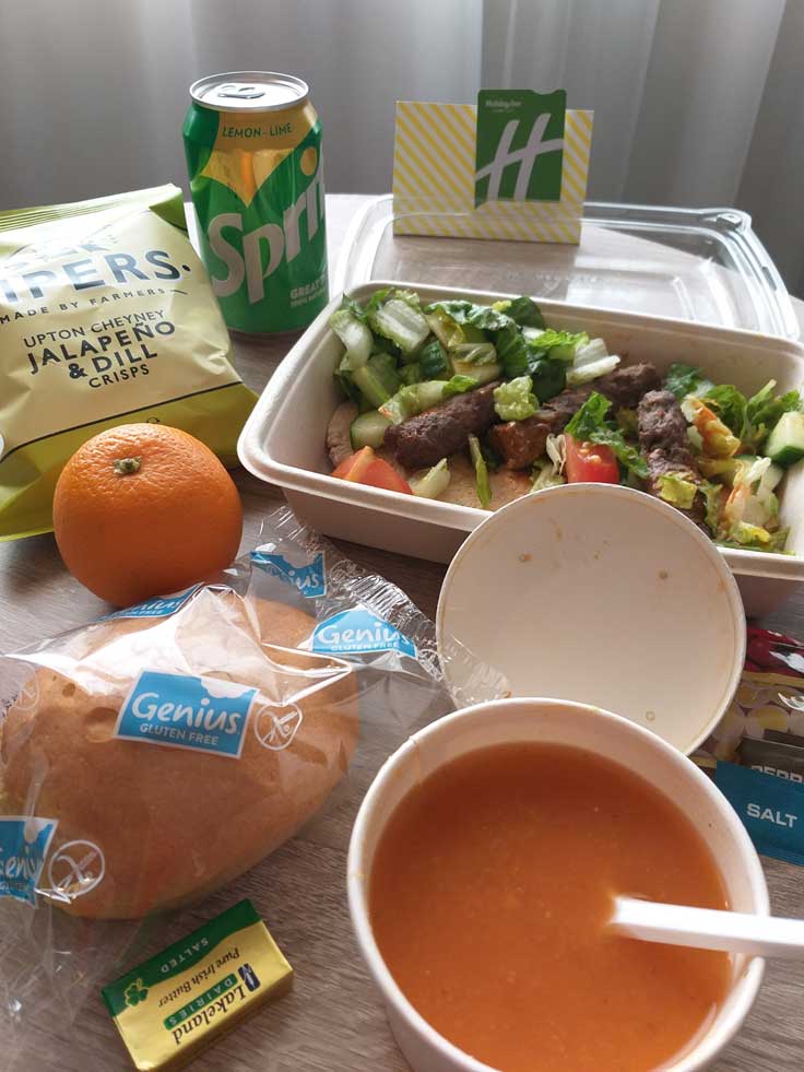 UK Hotel quarantine food lunch of lamb kofta salad and soup in takaway container